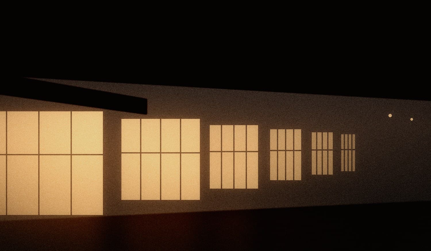 Sequência de vitrines iluminadas ao longo de uma avenida escura